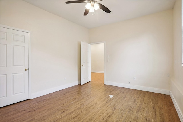 unfurnished room featuring light hardwood / wood-style floors and ceiling fan