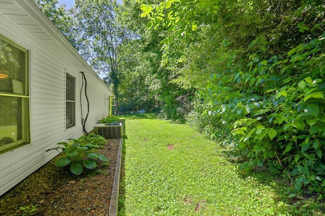 view of yard featuring central AC