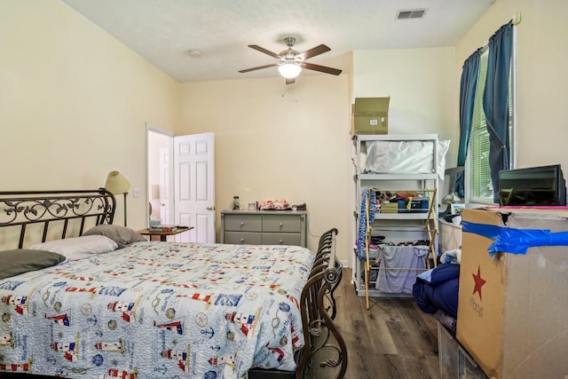 bedroom featuring ceiling fan and dark hardwood / wood-style floors