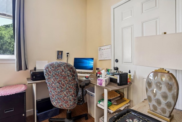 home office with wood-type flooring