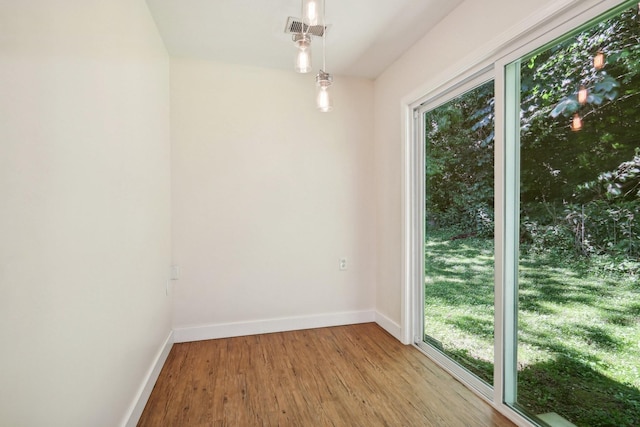 spare room with light hardwood / wood-style flooring