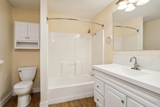 full bathroom with wood-type flooring, vanity, toilet, and shower / washtub combination