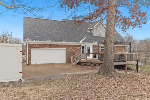 rear view of house with a deck