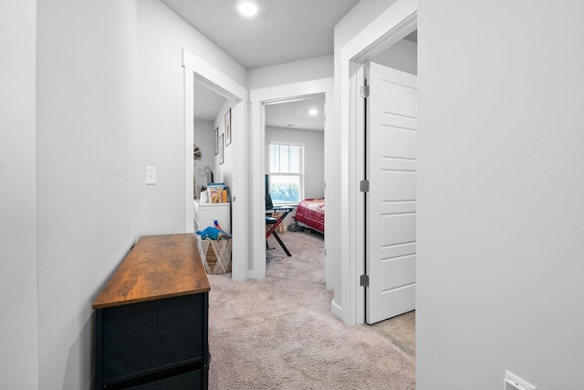 hallway with light carpet