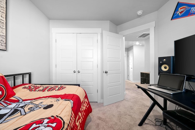 carpeted bedroom featuring a closet