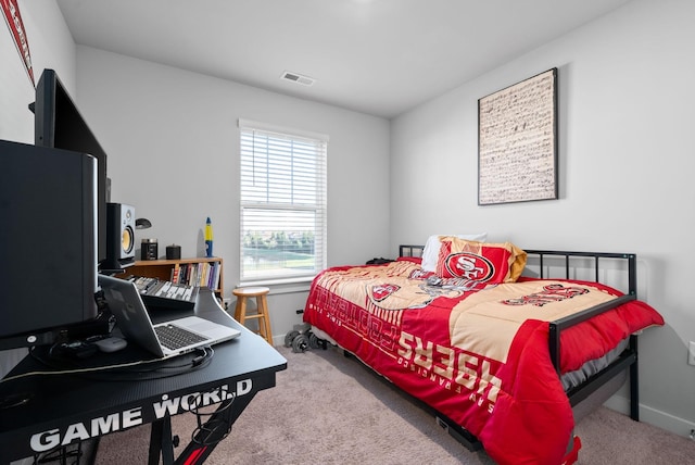 bedroom featuring carpet flooring and multiple windows