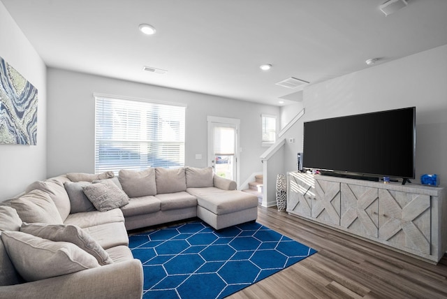 living room featuring dark hardwood / wood-style flooring