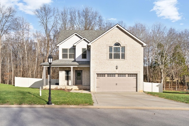 view of front of house with covered porch, a front yard, and a garage