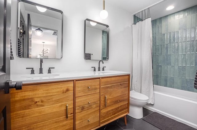 full bathroom featuring toilet, vanity, tile patterned floors, and shower / tub combo with curtain