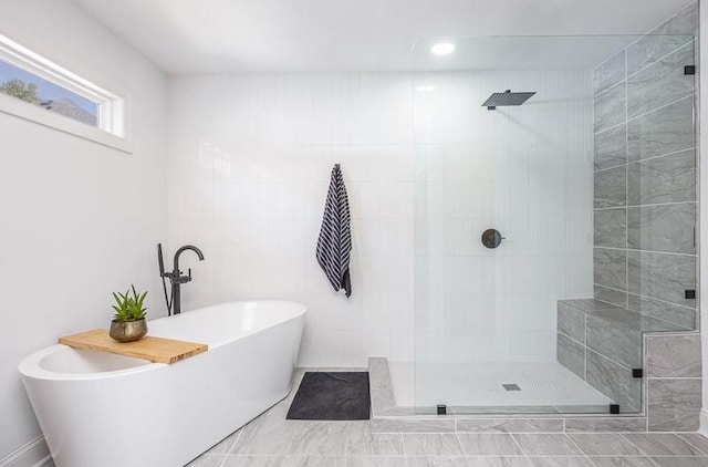 bathroom with separate shower and tub