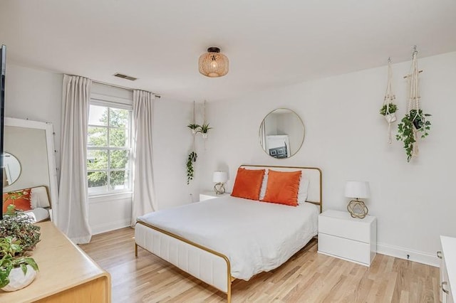 bedroom featuring light hardwood / wood-style floors