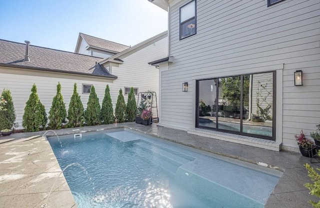 view of swimming pool featuring pool water feature