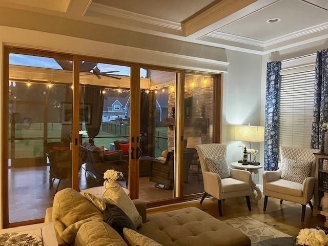 interior space featuring beamed ceiling, ceiling fan, crown molding, and coffered ceiling