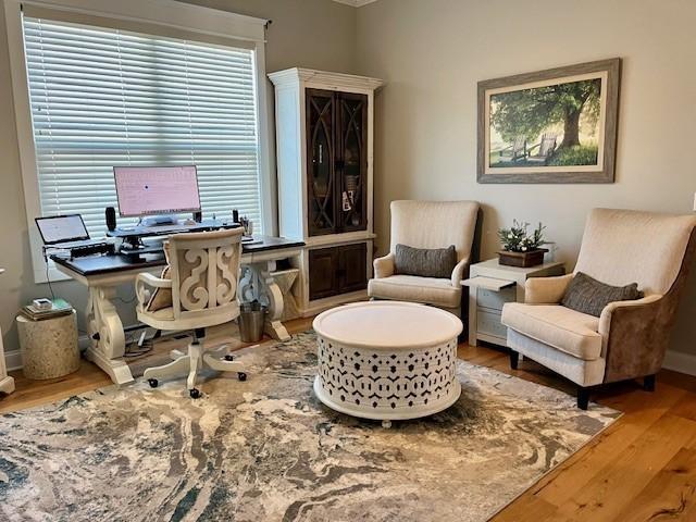 home office with hardwood / wood-style flooring