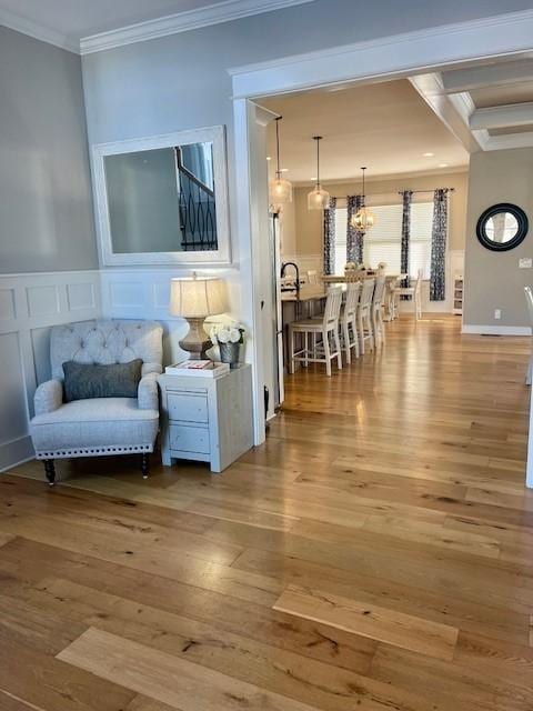 living room featuring ornamental molding and hardwood / wood-style flooring