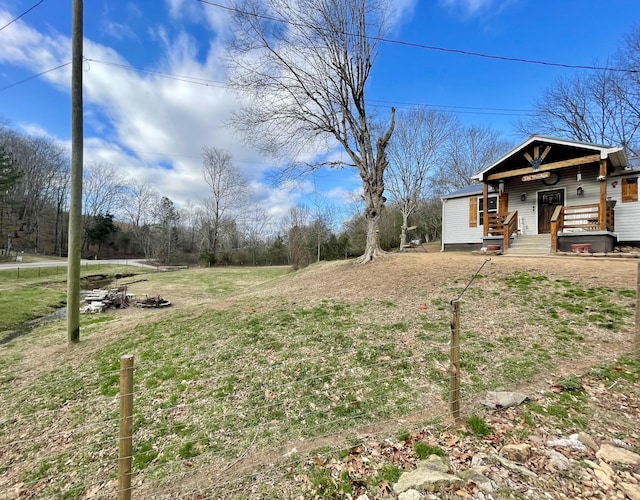 view of yard featuring covered porch