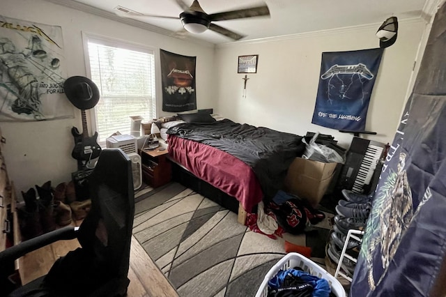 bedroom with ceiling fan and ornamental molding