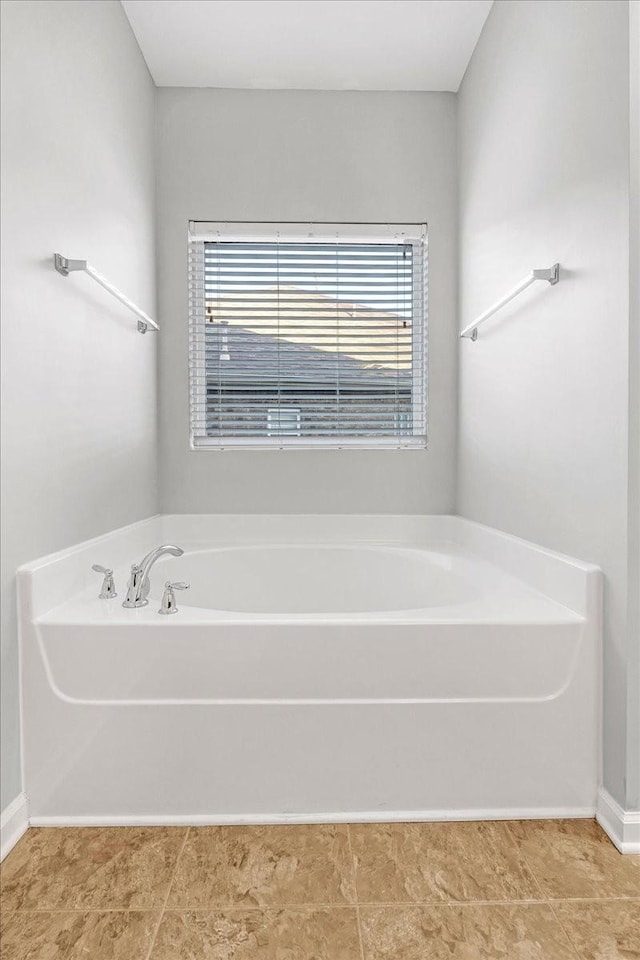 bathroom featuring a tub to relax in