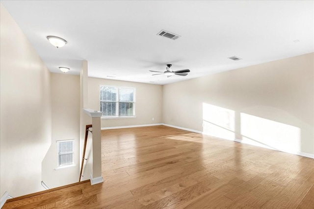 spare room with ceiling fan and light hardwood / wood-style floors