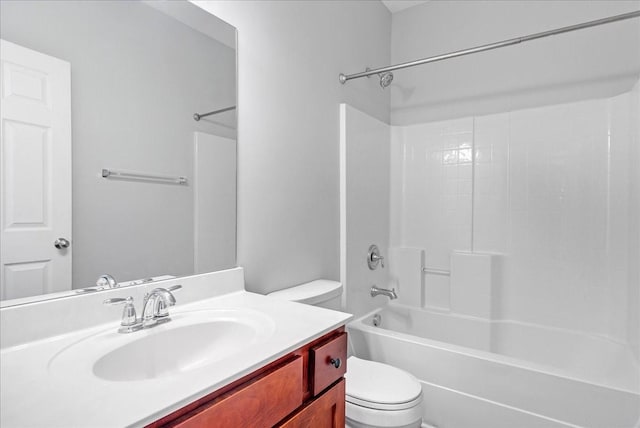 full bathroom with vanity, shower / bath combination, and toilet