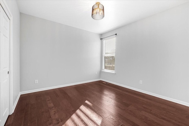 empty room featuring wood-type flooring