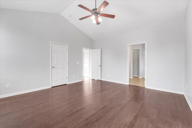 empty room featuring dark hardwood / wood-style floors, high vaulted ceiling, and ceiling fan