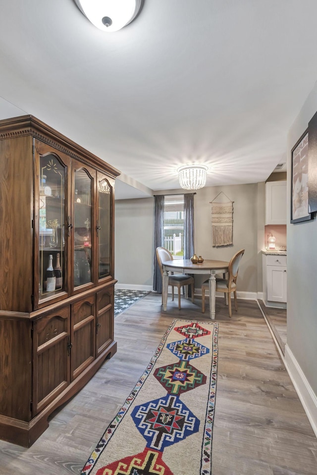 dining space with light wood-type flooring