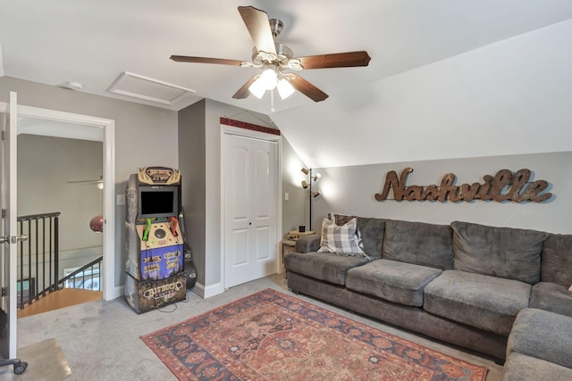 carpeted living room featuring ceiling fan and vaulted ceiling