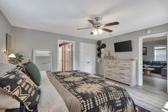 bedroom with light wood-type flooring and ceiling fan