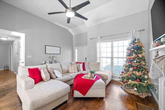 living room featuring ceiling fan, dark hardwood / wood-style flooring, and lofted ceiling