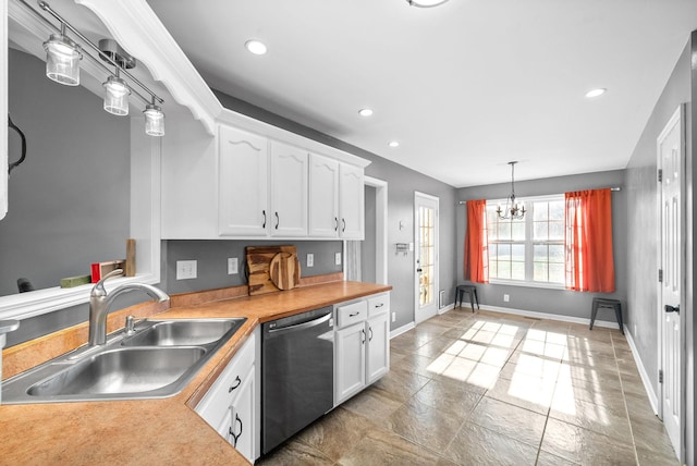 kitchen with pendant lighting, an inviting chandelier, white cabinets, sink, and stainless steel dishwasher