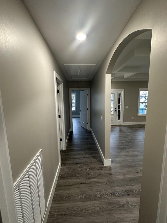 corridor with dark hardwood / wood-style floors