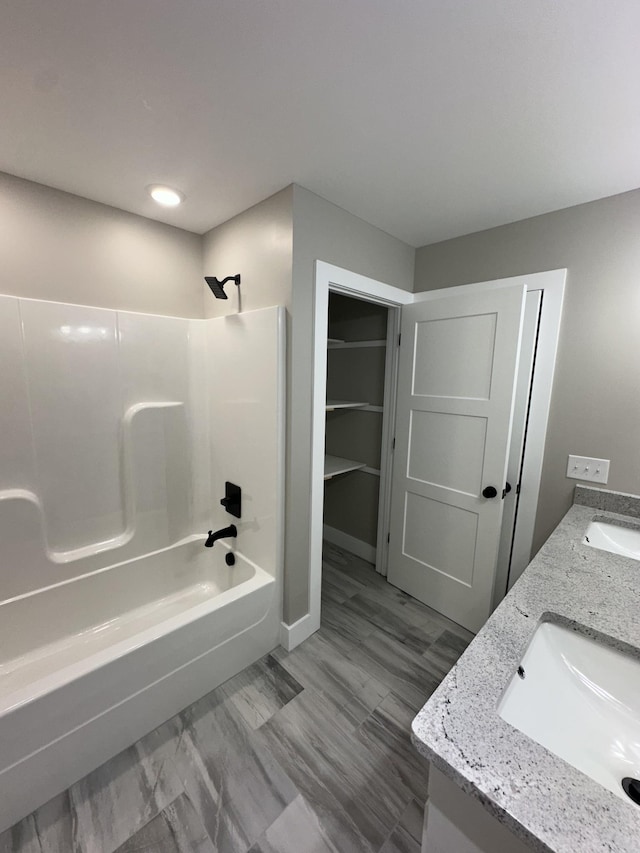 bathroom featuring vanity and shower / bathtub combination