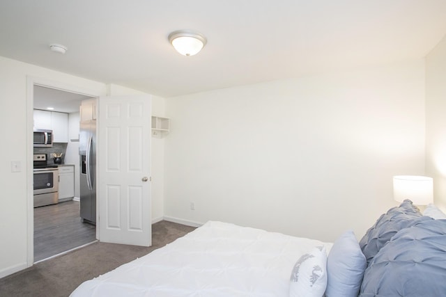 carpeted bedroom featuring stainless steel fridge