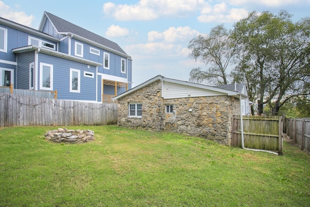 view of yard with an outdoor fire pit