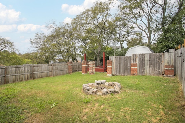 view of yard with an outdoor fire pit