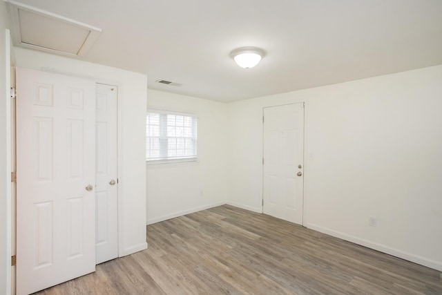 unfurnished bedroom with wood-type flooring