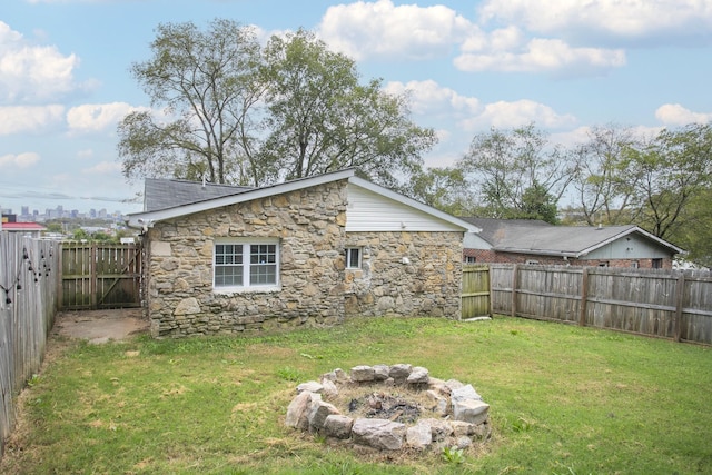 view of yard with an outdoor fire pit