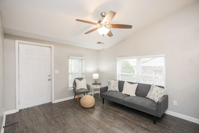 living room with vaulted ceiling, ceiling fan, and dark hardwood / wood-style floors