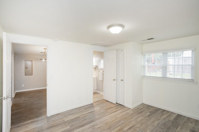 unfurnished room featuring wood-type flooring