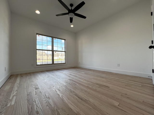 empty room featuring ceiling fan and light hardwood / wood-style floors