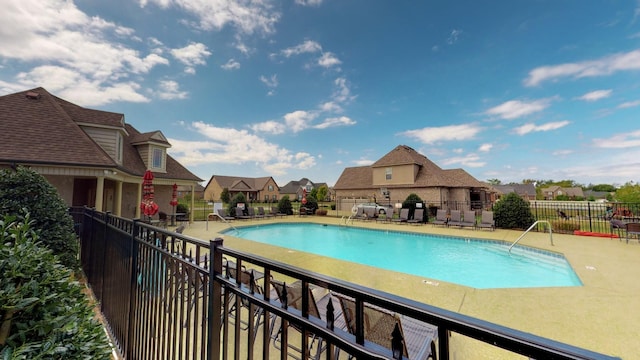 view of swimming pool featuring a patio area