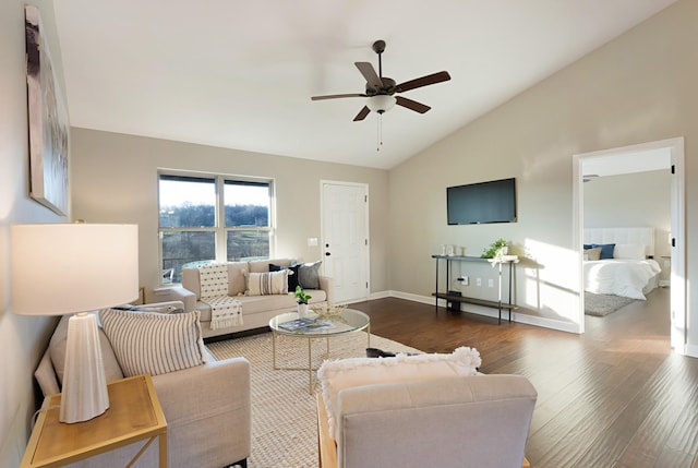 living room featuring ceiling fan, dark wood-type flooring, and vaulted ceiling