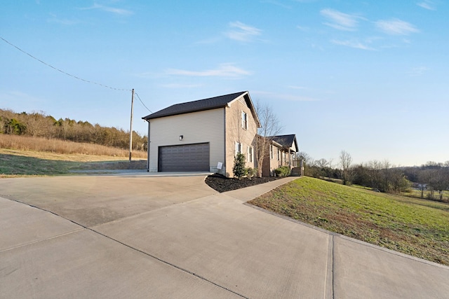 view of property exterior with a garage