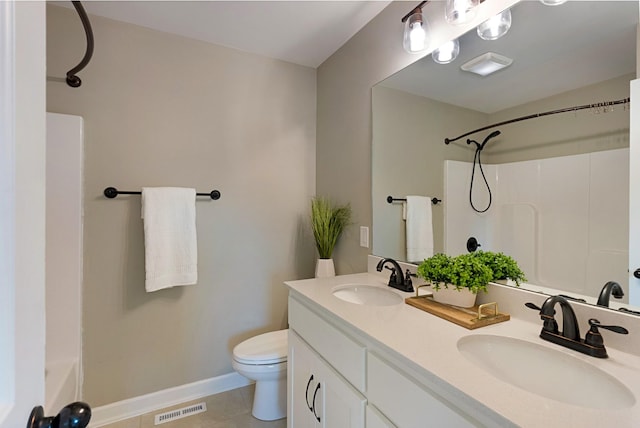 bathroom with tile patterned floors, vanity, and toilet