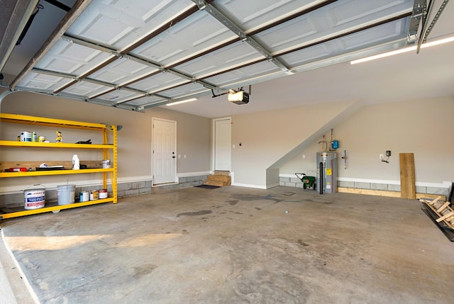 garage featuring a garage door opener and water heater