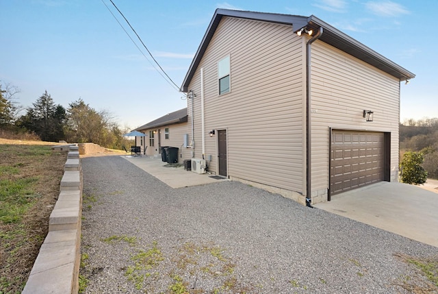 view of property exterior featuring a garage