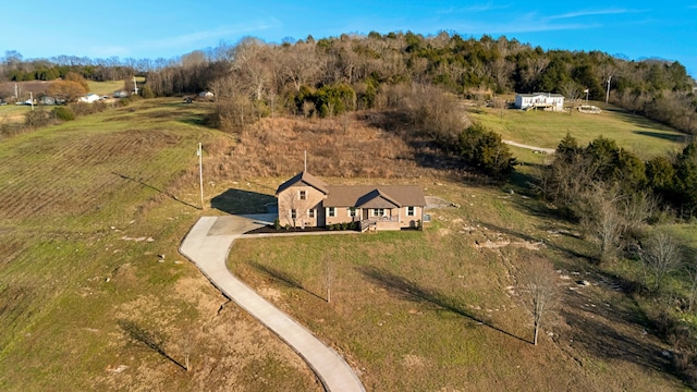 birds eye view of property with a rural view