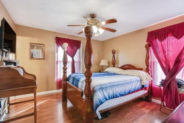 bedroom featuring hardwood / wood-style flooring and ceiling fan