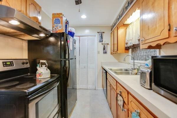 kitchen with sink, light tile patterned floors, and stainless steel appliances